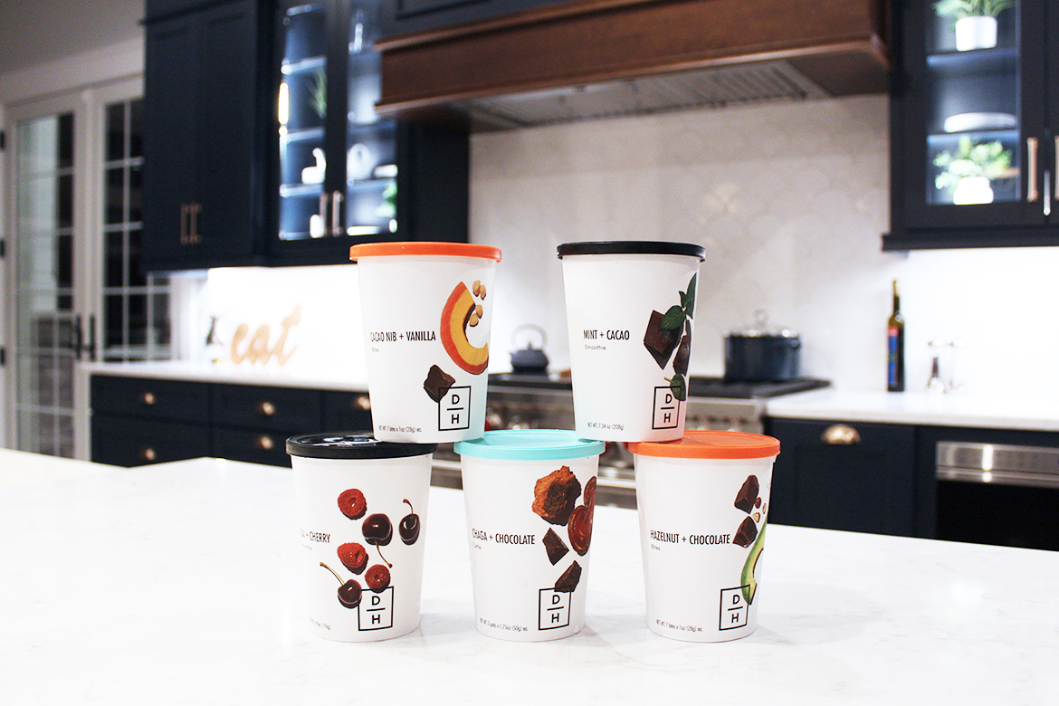 Daily Harvest cups on granite countertop in gourmet kitchen